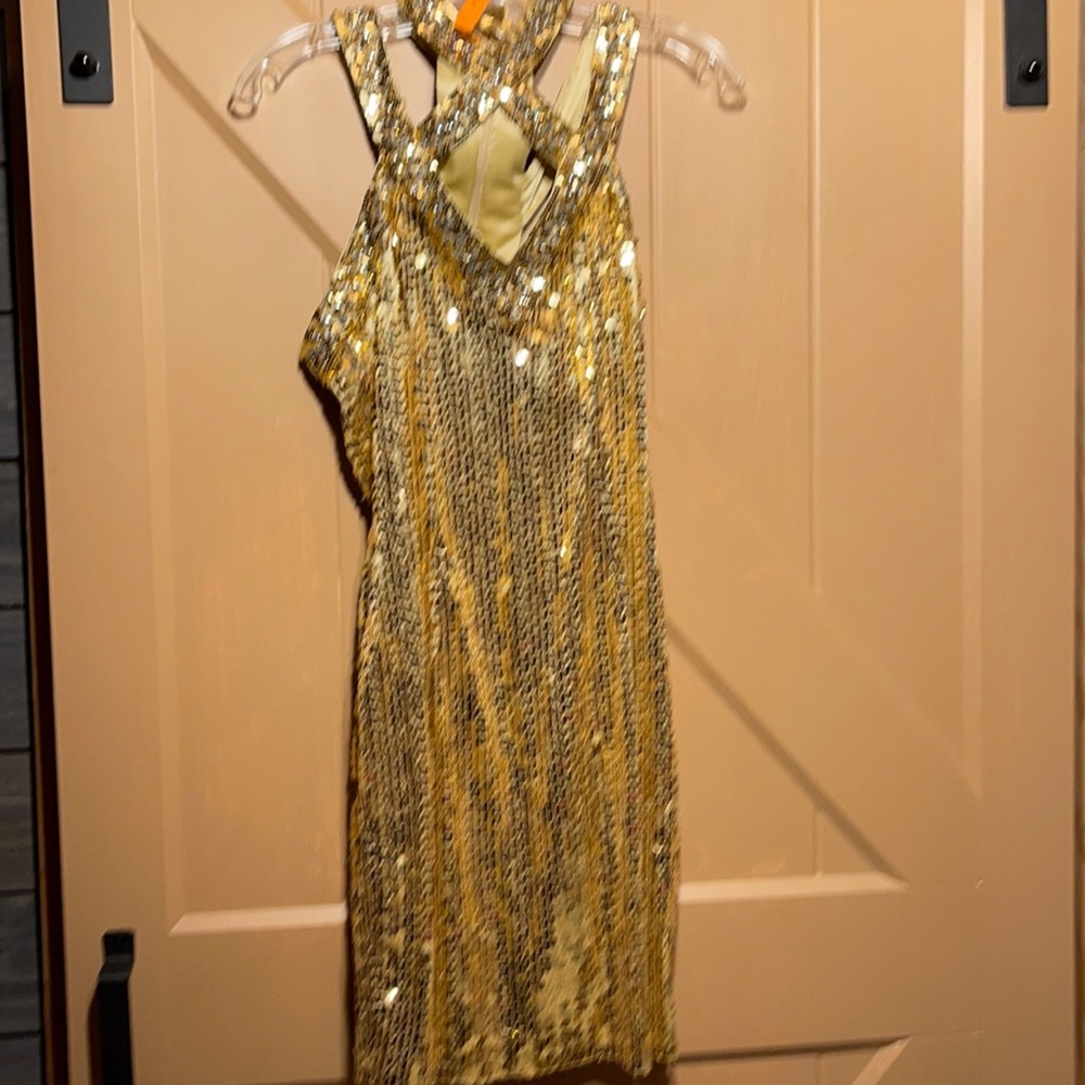 Short gold sequence gown with front crisscross strap